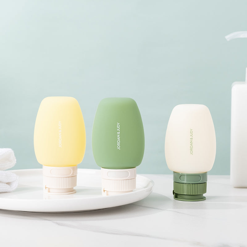 JORDAN&JUDY Lot de 3 bouteilles de voyage en silicone, rechargeables, anti-fuite, portables, pour shampoing et cosmétiques, 60 ml, Offre annuelle, Cadeaux phares